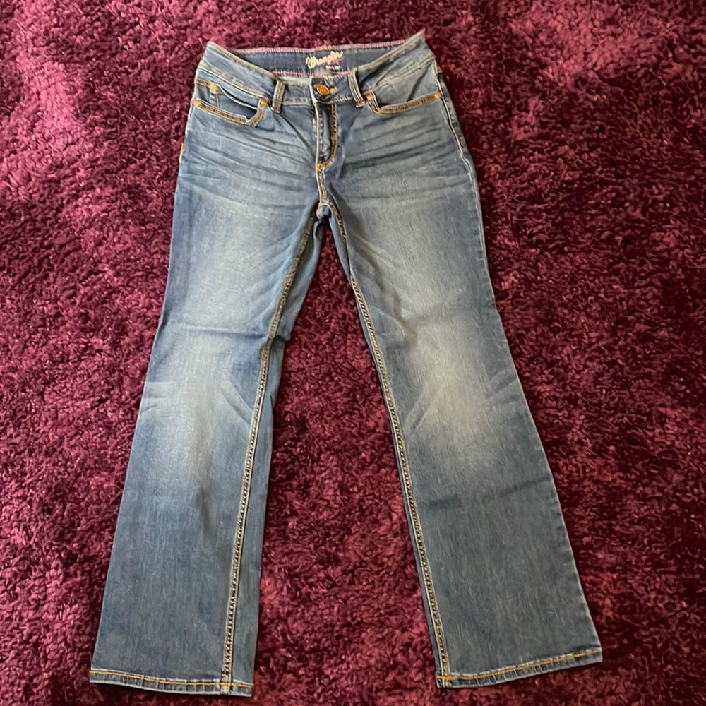 WRANGLER- medium-wash, boot cut; size 7/8x30.
